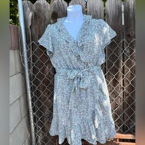 Cute summer evening party dress. Elegant ruffle detailing with a dainty print.